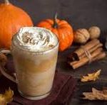 A vibrant, top-down photo of a pumpkin spice latte from a local London, Ontario cafe.