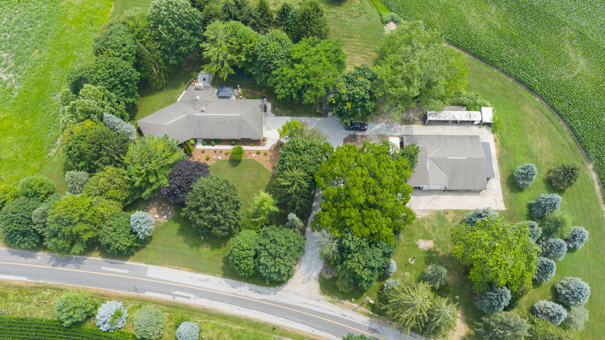 Aerial view of 29159 Lakeview Line showing the home, workshop, garages and 1.89 acres in Wallacetown