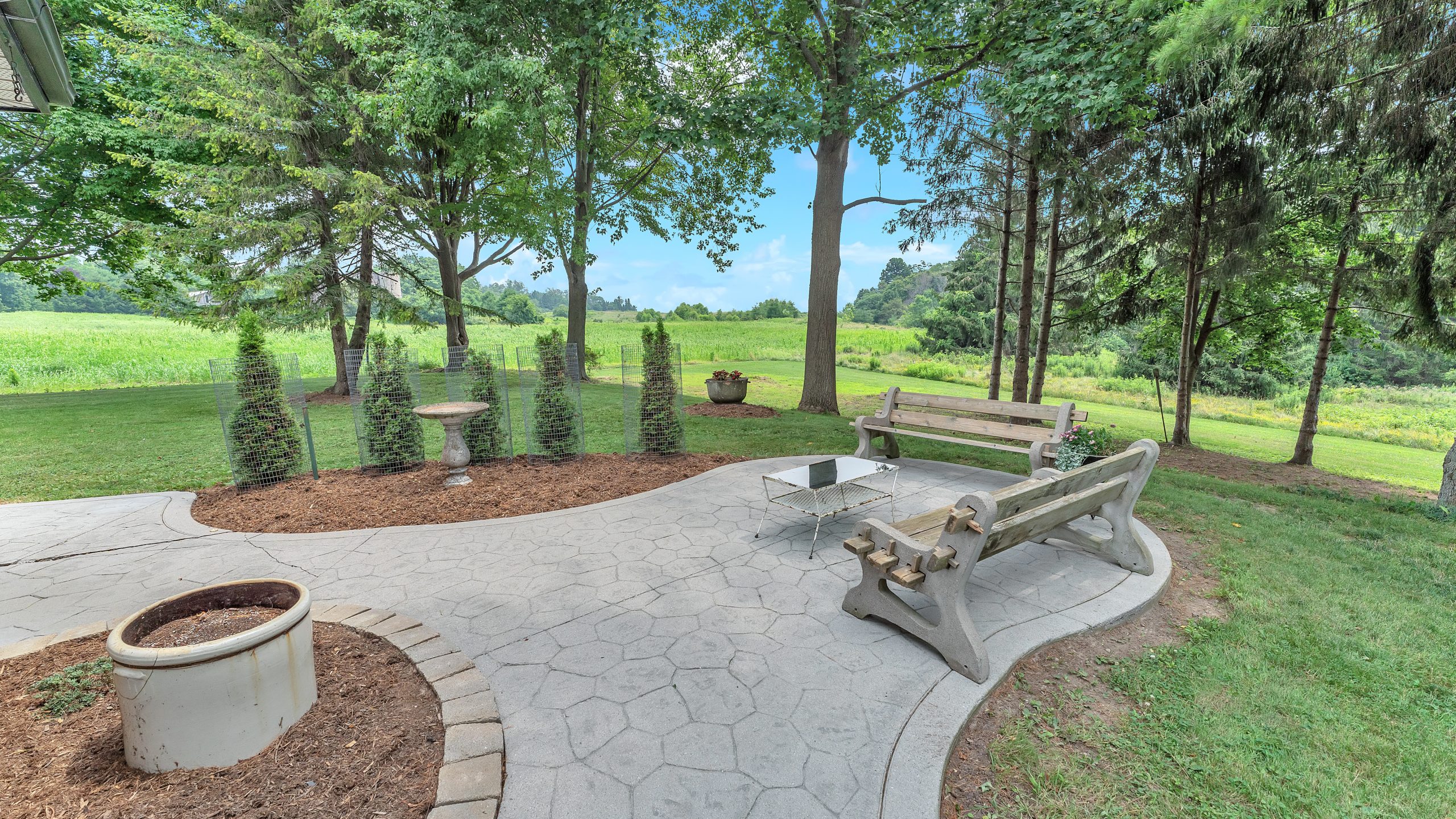 Outdoor patio at 29159 Lakeview Line overlooking the 1.89-acre property in Wallacetown